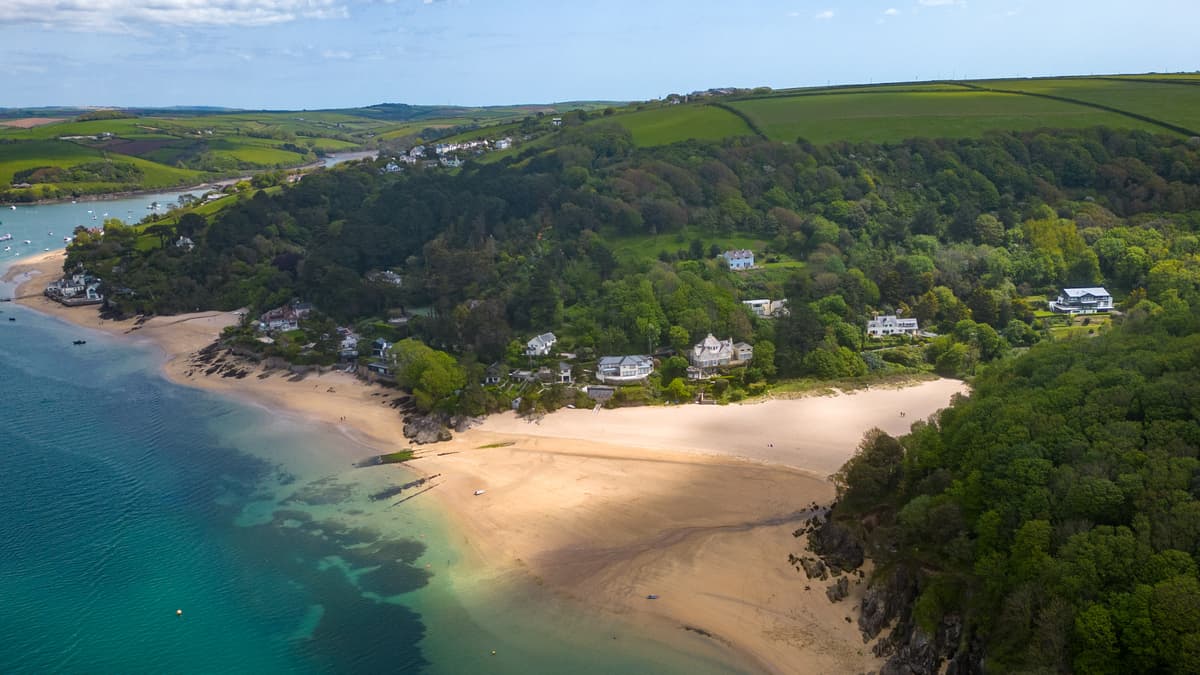 cottage for sale sits directly on the beachside with